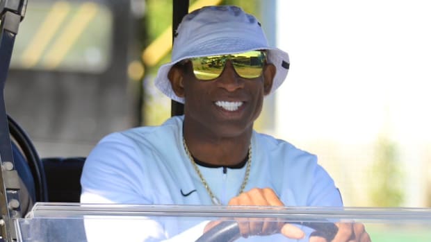 Deion Sanders on a golf cart at CU Fall Camp